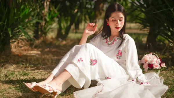 a woman sit in the ground 3‑Piece Embroidered Lawn Suit